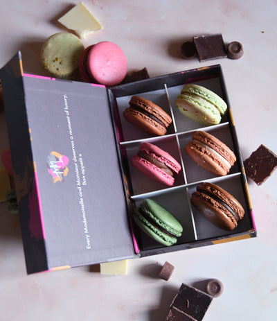 Luxury chocolate macaron gift box of 12 assorted flavours, ideal for birthdays, anniversaries and gifting by post
