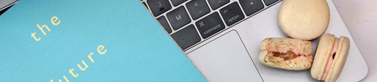 half eaten macarons on laptop