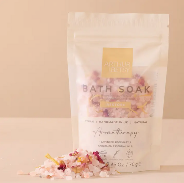 Arthur Betsy Restore Bath Soak in a resealable stand-up pouch, with loose bath salts featuring Lavender, Rosemary & Cardamom essential oils. Part of the Relaxation Macaron Gift Set.