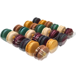 Assorted colorful macarons in a clear plastic bag on a white background