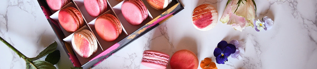 pinks and reds macarons in gift box