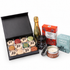 Large Branded Prosecco Hamper - open branded macaron box with mini Bottega Gold Prosecco, chutney, shortbread, cheese sables and candle
