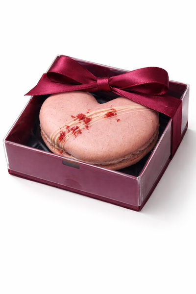 Loveheart shaped macarons in a red box