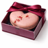 Loveheart shaped macarons in a red box