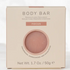 A square beige box for a pinkish body bar product labeled 'BODY BAR' and 'FOCUS', with the blended aroma of Cedarwood, Sandalwood and Eucalyptus. Part of the Relaxation Macaron Gift Set.